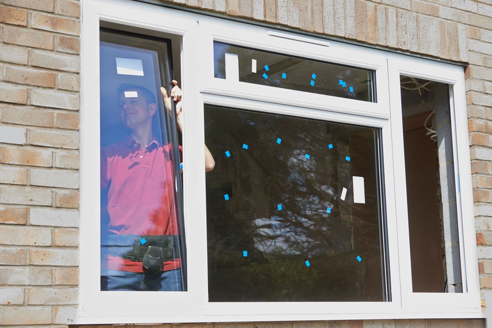 Construction Worker Installing new windows.
